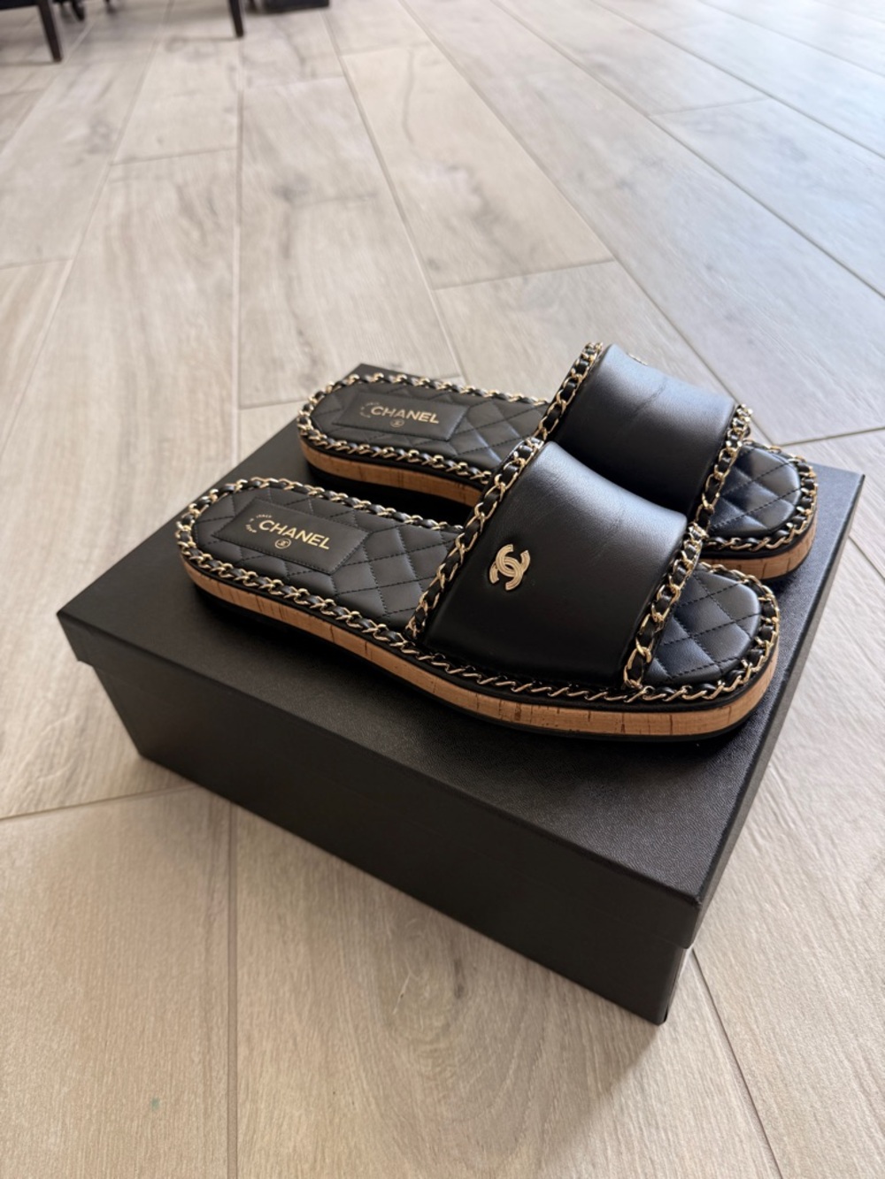 CHANEL Black Quilted Leather Slide Sandals with Gold Chain Trim